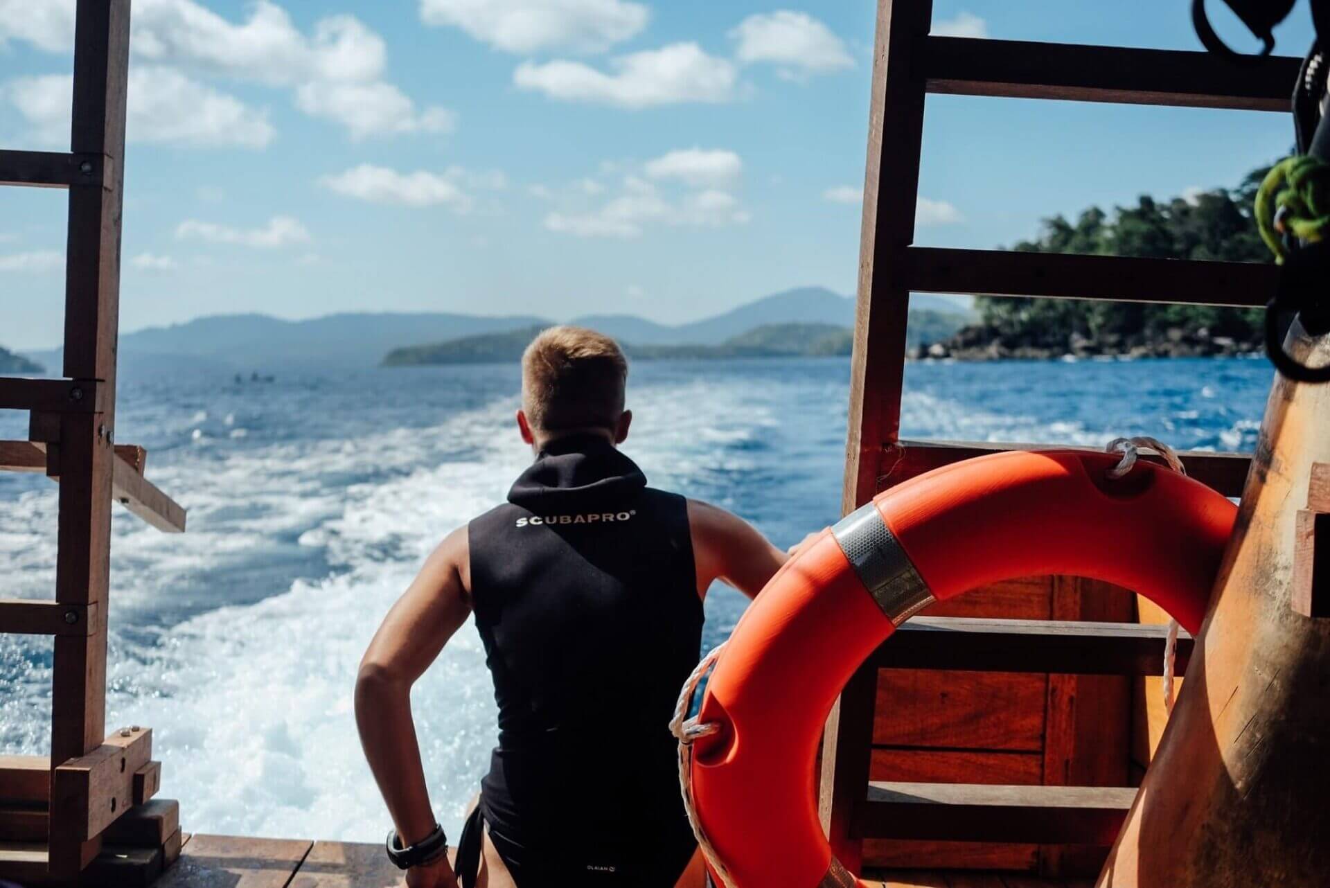 Scuba diver enjoying the panoramic view from the back of the boat