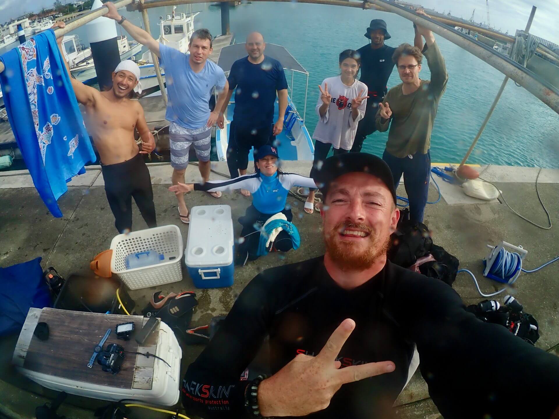 A group of ecstatic divers capture the perfect selfie by the sea